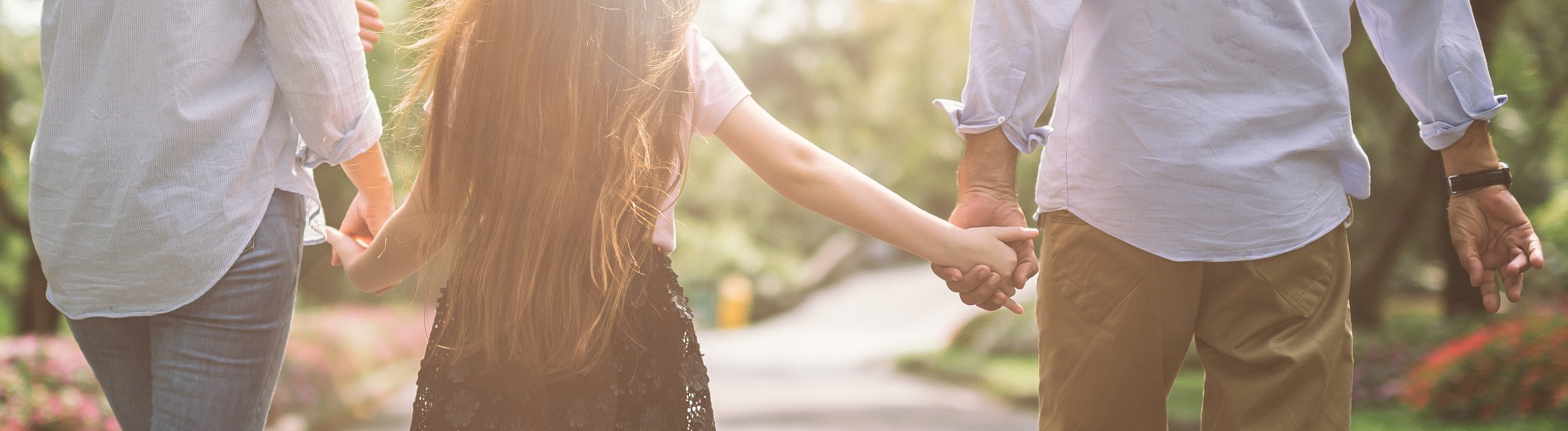 child holding parent hands